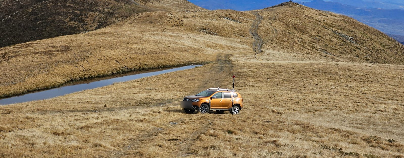 Our car beside a small tarn on the alpine ridge where the walk to Leaota summit begins